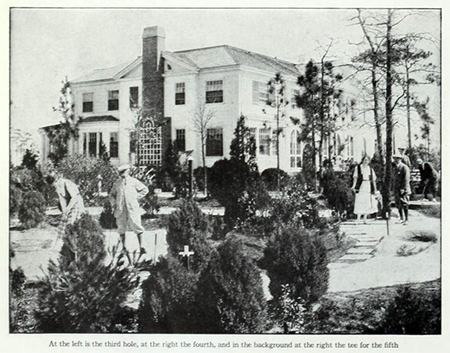 Photograph of James Barber's "Thistle Dhu,". A large house overlooks a miniature golf course. Black and white photo.