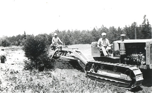Workers clearing areas of what is now Umstead State Park, ca. 1940-1950. From the collection of North Carolina State Parks.
