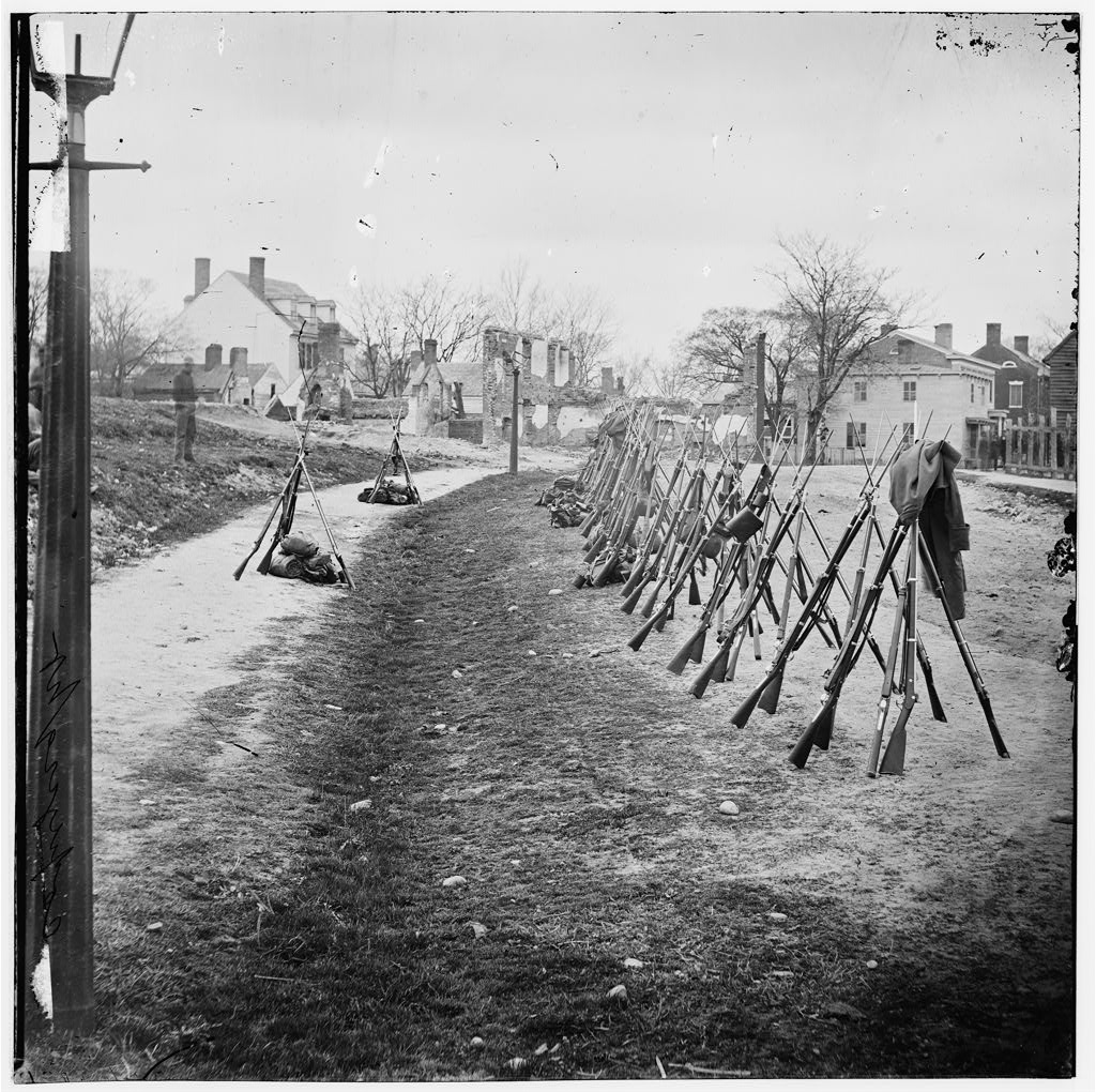 In Petersburg, Virginia, a row of Union rifles stand stacked against each other.