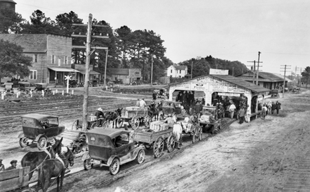 Farmers line up to sell strawberries at the market in Chadbourn, a traditional center for production of the crop in North Carolina, ca. 1920. North Carolina Collection. University of North Carolina at Chapel Hill Libraries.