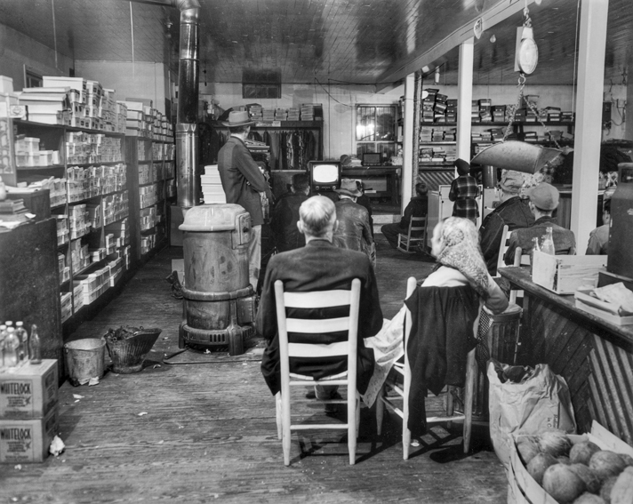 Cary Durham store in Bynum, 1952. People have gathered to watch one of the first television sets in the community. Photograph by Roland Giduz. North Carolina Collection, University of North Carolina at Chapel Hill Library.