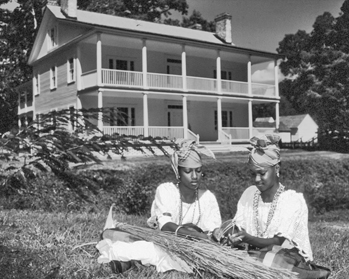 A contemporary interpretive demonstration of slave labor outside the plantation house at Somerset Place. Photograph by Charles E. Jones. North Carolina Department of Transportation.