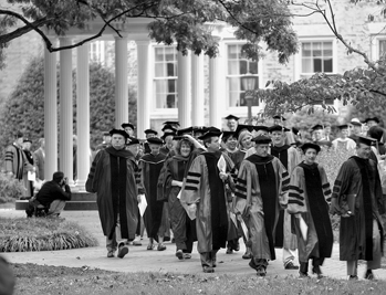 Faculty of the University of North Carolina at Chapel Hill process to a convocation on University Day, late 1990s. The Old Well appears in the background. Photograph by Justin Smith. UNC-Chapel Hill News Services.