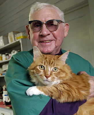 Veterinarian James Everett Brown has a cat of his own. Photo by Chris Seward, 2005. 