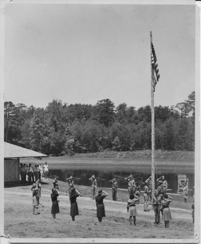 Scouts saluting the American Flag, grand opening of the community park in Mayodan, N.C. on July 3, 1948. Today the site is Mayo River State Park. From the North Carolina State Parks Collection, NC Digital Collections.