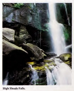 Image of exposed granite face of High Shoals Falls (Burke County, N.C.). From the <i>Geologic Guide to North Carolina's State Parks</i>, published 1989 by the North Carolina Geological Survey. Presented on NC Digital Collections.