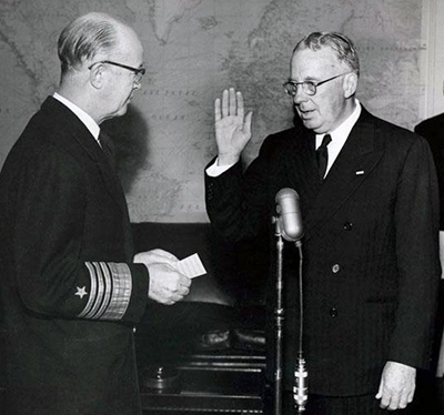 A January 15, 1954 photograph of Thurmond Chatham being sworn in as a Naval Reserve captain. Image from the North Carolina Museum of History. 