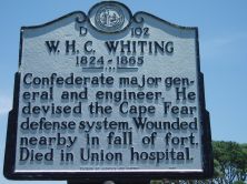 William Henry Chase Whiting's marker on US 421 at Fort Fisher State Historic Site. Photo is courtesy of North Carolina Highway Historical Marker Program.