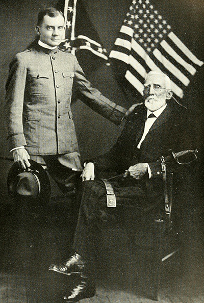 A photograph of George Washington Finley Harper (sitting) with his grandson, Lieut. James C. Harper, published in 1919. Image from the Internet Archive.A 