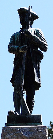 Photograph of the statue of James Hunter on the Hunter Monument at the Alamance County Battleground, Burlington, NC. Item #S.HS.2008.45.1, from North Carolina Historic Sites, North Carolina Department of Cultural Resources. The monument was originally intalled at the Guilford Battle Ground in Greensboro, NC but was later relocated to the Alamance County battlefield, site of the Regulator defeat in 1771.     .