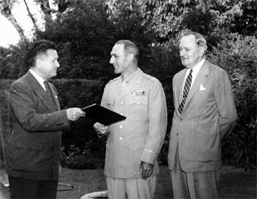 Photograph of Maj. Gen. William Carey Lee (center) with Col. John N. Harrelson, Chancelor of NSCU (left) and G. S. Varris, Assistant Controller (right).  Lee is receiving the honorary degree of Doctor of Military Science.  Item 0226861, Special Collections Research Center, North Carolina State University Libraries, Raleigh, North Carolina.  Used by permission. 