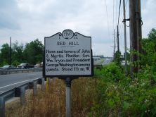 Photograph of "Red Hill" N.C. Historical Highway Marker (#L-84), located in Cabarrus County, North Carolina.  Red Hill was the location of the home and tavern of Martin Phifer.  George Washington is believed to have stayed there on his southern tour in 1791 and was a friend of Martin Phifer, Jr. Image used courtesy of the North Carolina Department of Cultural Resources. 