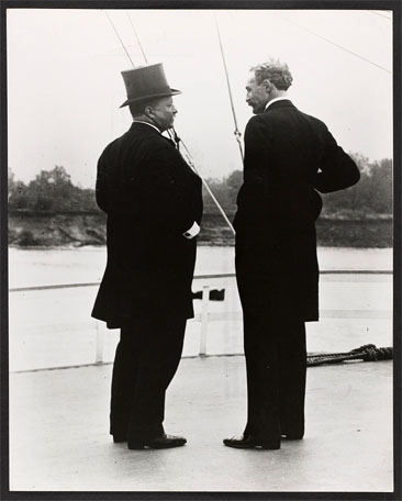 "President Theodore Roosevelt and Chief Forester Gifford Pinchot -- T.R. and G.P. -- on the river steamer Mississippi  This picture was taken on the trip of the Inland Waterways Commission down the Mississippi River in October 1907." Black and white photograph by the U.S. Forest Service, taken October 1907.  From the Pinchot Collection, Library of Congress, Prints & Photographs Online Catalog. 