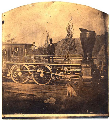 Photograph of the "Romulus Saunders," an early locomtive of the Raleigh & Gaston Railroad, image circa 1870-1890. Item  H.19XX.135.38, from the North Carolina Museum of History.  Gaston HIllary Wilder was president of the Raleigh & Gaston Railroad beginning in 1858. 