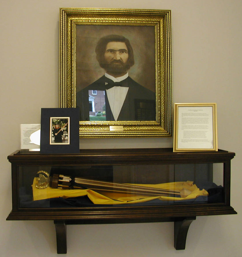 Portrait of Washington Manly Wingate (with other artifacts) in the Wingate University Archives, Wingate, NC.  From North Carolina Cultural Heritage Institutions, NC ECHO Project, North Carolina Digital Collections. The town of Wingate, NC and Wingate University were named in honor of Washington Manly Wingate. 