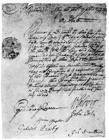 Primary record relating to Thomas Cary. Wispy cursive writing on a tattered piece of parchment.