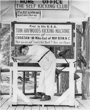 Tom Haywood, of Croatan, demonstrates his kicking machine. Image courtesy of the North Carolina Museum of History.