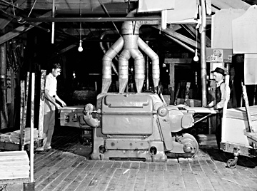 Jennings Furniture Company, Lenoir, NC (Caldwell County); Cutting, Boring, Automatic Sanding, 1940s, photo by Patrick. From North Carolina Conservation and Development Department, Travel and Tourism Division photo files, North Carolina State Archives, call #:  ConDev3190A. 