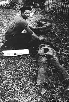 "Nelson Johnson at the body of Dr. James Waller, November 3, 1979, Greensboro, NC. " Photo courtesy of the Carolinian. "Nelson Johnson at the body of Dr. James Waller, November 3, 1979, Greensboro, NC. "