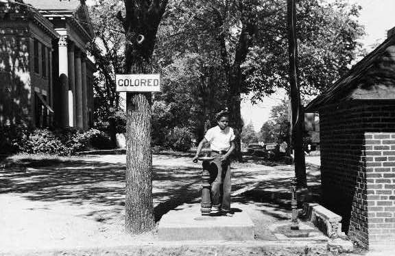 Drinking fountain on the county courthouse lawn, Halifax, North Carolina . Photograph created by  John Vachon. Image courtesy of Library of Congress. 