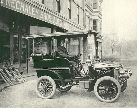 Joe Mechaley in a "White" steam automobile. Early 1900s. 
