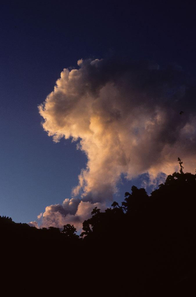Clouds hover over a mountain NCpedia