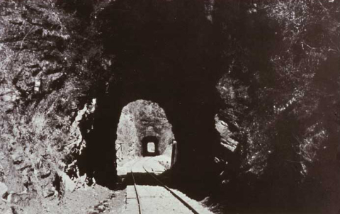 Historic Postcard of rail line through Lick log Tunnels