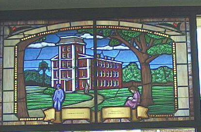 "Stained glass window depicting the surviving Yadkin College building. (Window is at the West Davidson Public Library, Tyro)." Image courtesy of State Archives of North Carolina. 